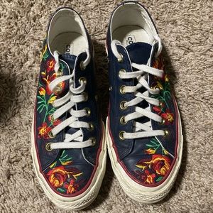 Navy Blue Converses with Red and Orange Flowers embroidered.